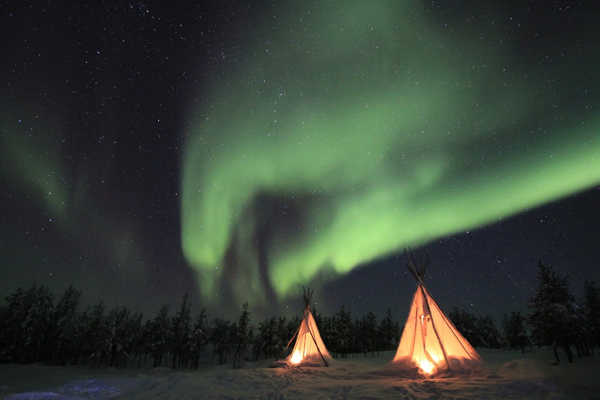 Northern lights over a campsite